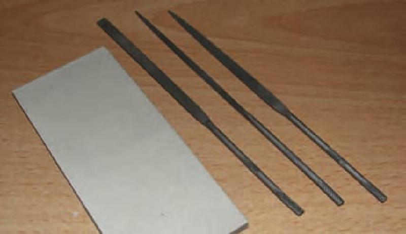 Very Fine Sandpaper for final surface finishing and a good small file set.